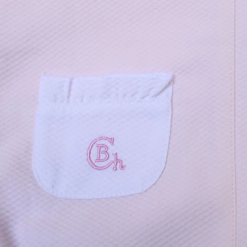 Detalle bolsillo trasero del Mono con bolsillos en rosa y blanco de Chocolat baby