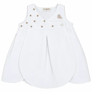 Vestido bebé blanco de piqué Manchester Chocolat Baby con bordado dorado y cierre frontal de botones.