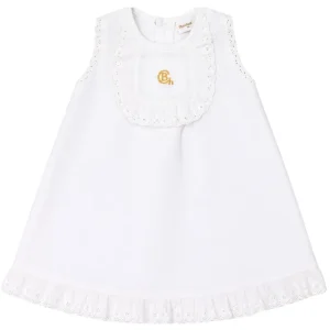 Vestido bebé blanco con bordado dorado de Chocolat Baby, confeccionado en tejido de piqué, ideal para ofrecer comodidad y un acabado elegante.
